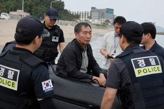 Dong Guangping Reaches South Korea by Rubber Boat